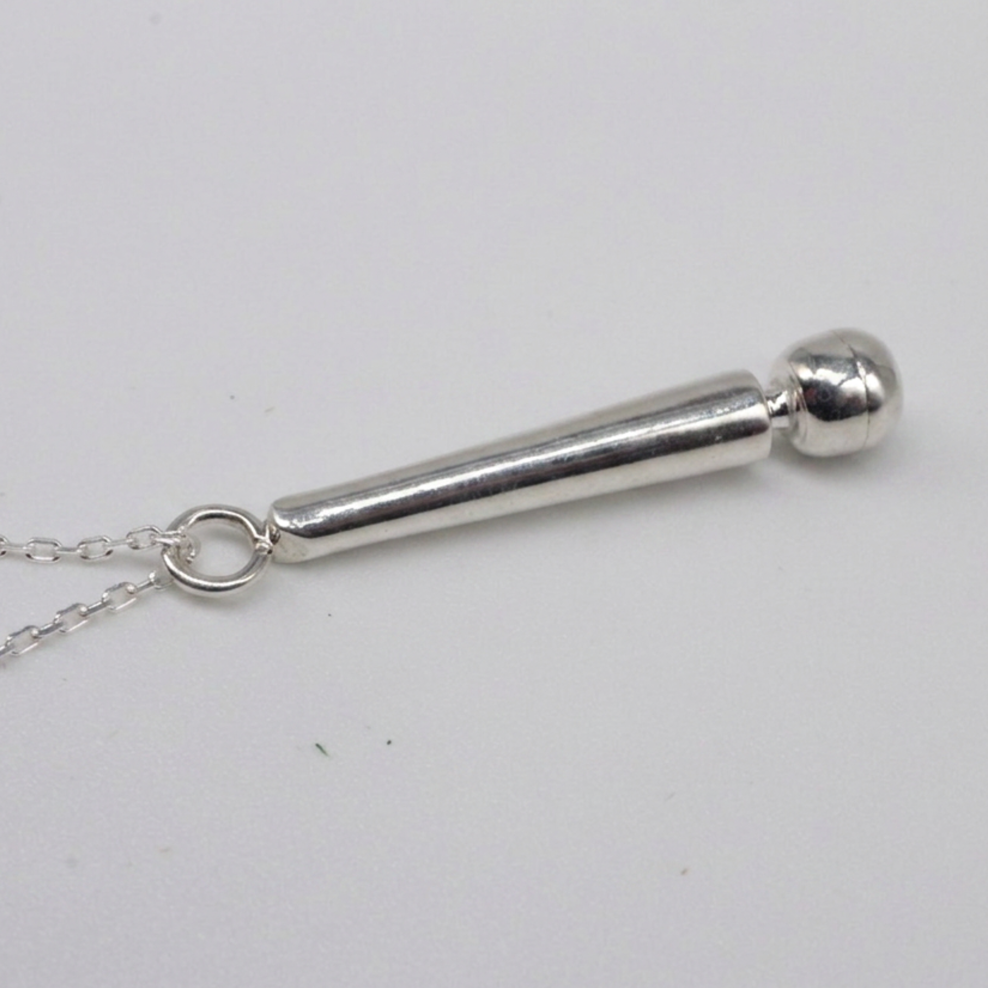Close-up view of the solid silver Magic Wand pendant showcasing precise CAD design geometry by a GIA Certified Specialist.