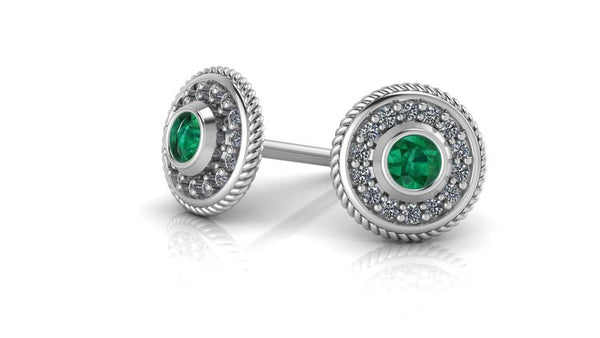 Image of two sterling silver studs with a green birthstone in the middle
