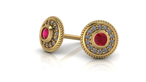 Image of two 14k gold studs with a ruby birthstone in the middle with diamonds encrusted around it
