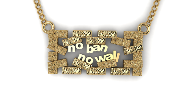 Image of a gold pendant with bricks surrounding the words “No Ban No Wall”